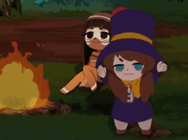 a girl in a blue hat is standing next to another girl