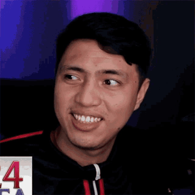 a close up of a man making a funny face with his mouth open .
