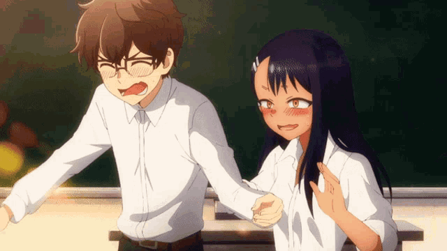 a boy and a girl are standing next to each other holding hands