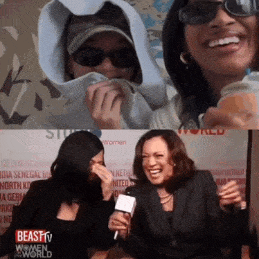 two women are laughing in front of a beast tv sign