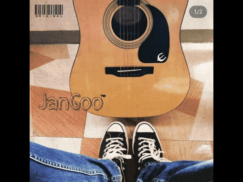 a person 's feet are standing next to an acoustic guitar that says jangoo on it