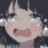 a close up of a girl 's face with tears running down her cheeks .