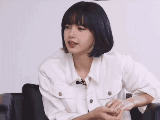 a woman in a white jacket is surrounded by curious words