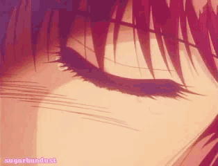 a close up of a person 's eye with sugarbundust written on the bottom right