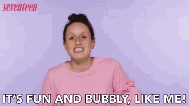 a woman in a pink shirt is saying `` it 's fun and bubbly , like me ''