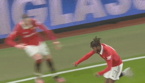 a soccer player with the number 17 on his shirt is laying on the ground