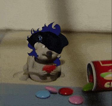 a cartoon drawing of a hamster eating a heart next to a container of candy
