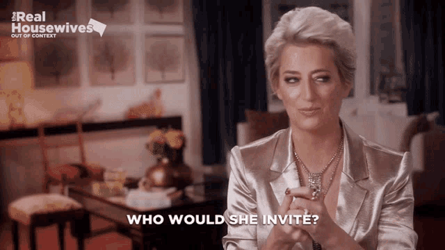 a woman says who would she invite in front of a real housewives sign