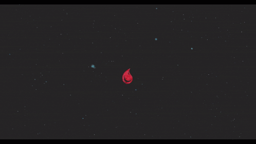 a large red object in the middle of a black background