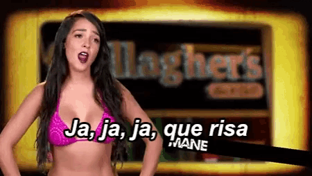 a woman in a bikini is standing in front of a sign that says laghers