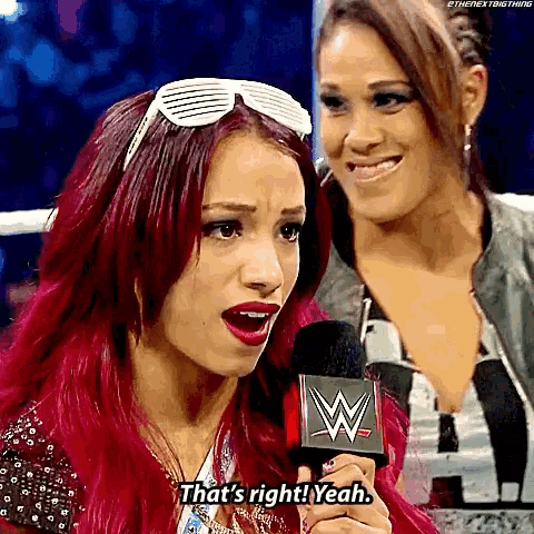 a woman with red hair is talking into a microphone and saying that 's right yeah .