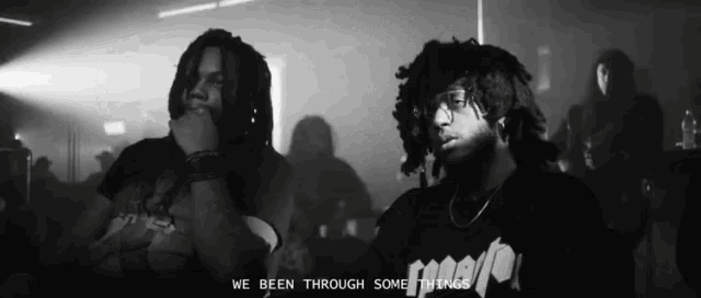 a black and white photo of two men with the words " we been through some things "