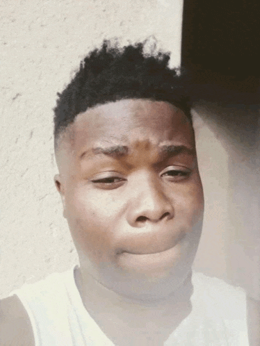 a young man making a funny face with his mouth open
