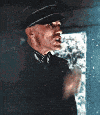 a man in a military uniform has a badge on his collar that says ' sss ' on it