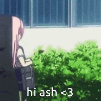 a girl with pink hair is standing in front of a bush and a window .