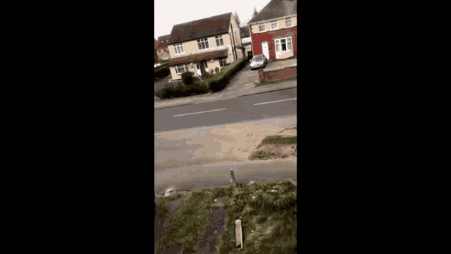 a blurred image of a house and a street