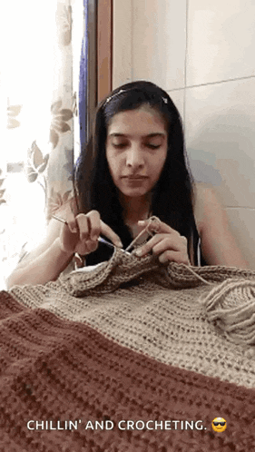 a woman is crocheting a blanket with the words chillin ' and crocheting