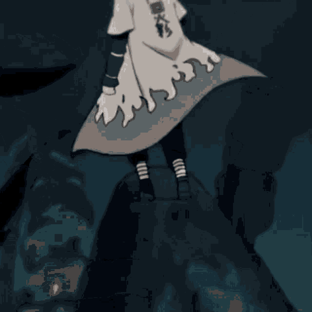 a close up of a person holding a sword in their hand .
