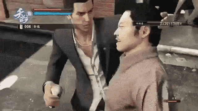 a man in a suit is fighting another man in a video game on a street .