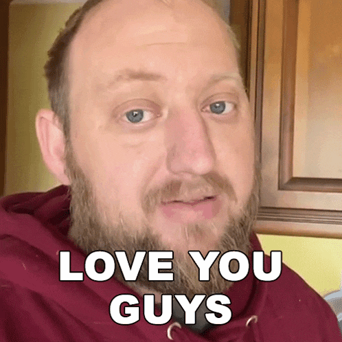 a bald man with a beard is wearing a red hoodie and says " love you guys "