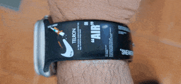 a person wearing a wristband that says air on it