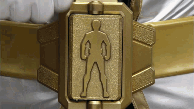 a gold belt with a silhouette of a man in it