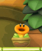 a cartoon plant in a pot with a face on it