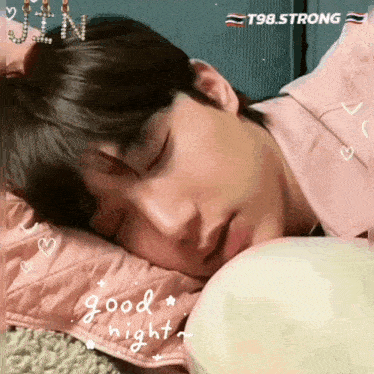 a young man is sleeping on a pillow with the words good night written on the bottom
