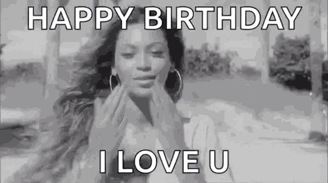 a black and white photo of a woman blowing a kiss and saying `` happy birthday , i love u '' .