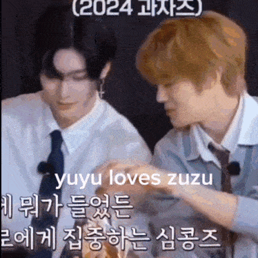 a couple of men standing next to each other with a caption that says yuyu loves zuzu .