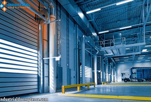 a large warehouse with industrialdoorsystems.com written on the bottom right