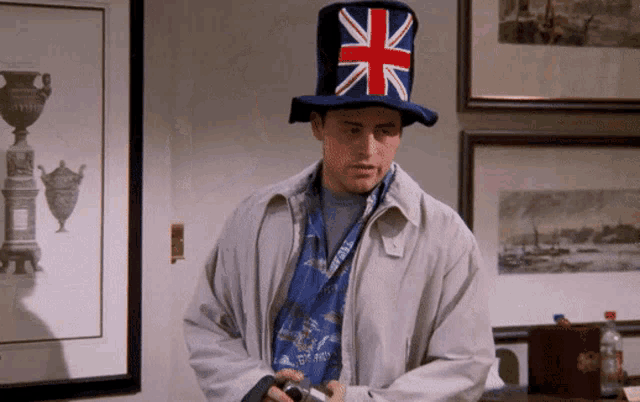 a man wearing a top hat with a union jack on it