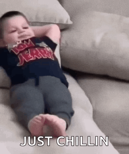 Lil Kid Chilling Chilling On Couch GIF - Lil Kid Chilling Chilling On Couch Little Kid Chilling On The Couch GIFs