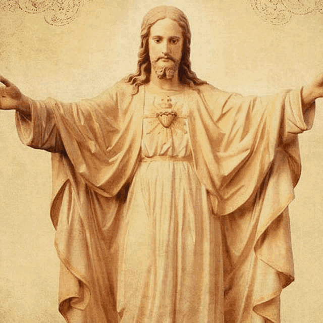 a statue of jesus with his arms outstretched has a heart on his chest