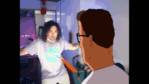 a man with curly hair wearing a shirt that says ' king of the hill '