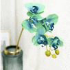 a vase filled with blue and green flowers on a table .