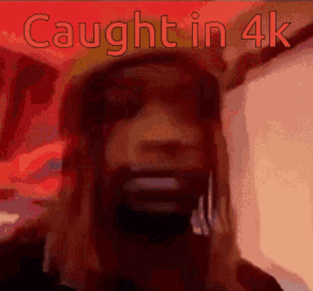 a picture of a man with the words caught in 4k written above him