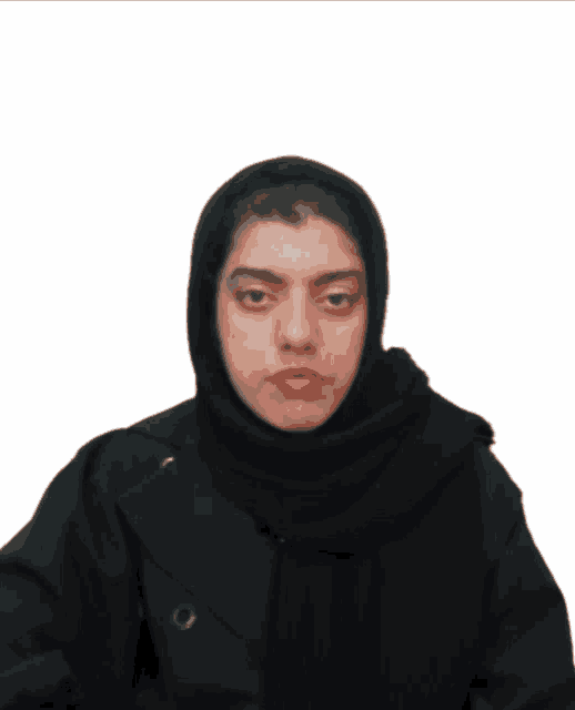 a woman wearing a black scarf and a black jacket