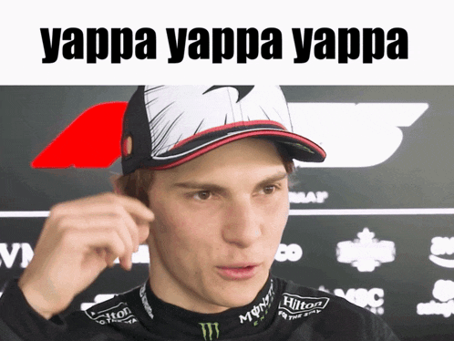 a man wearing a hat with the words yappa yappa yappa above him