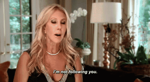 a woman is sitting in a living room and saying i 'm not following you