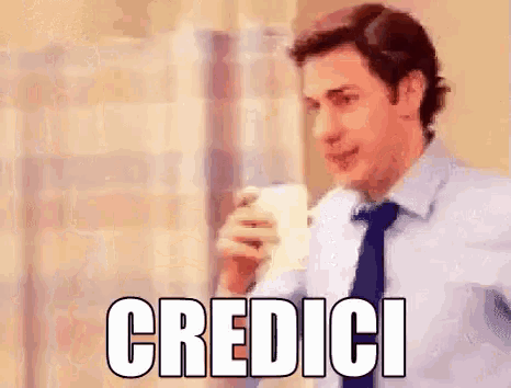 a man in a suit and tie is drinking a cup of coffee and the word credici is written above him .