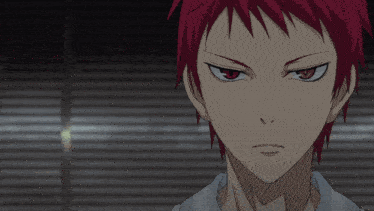 a close up of a person 's face with red hair and black eyes