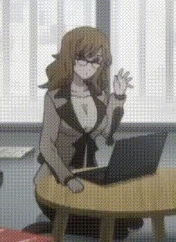 a woman sitting at a table with a laptop