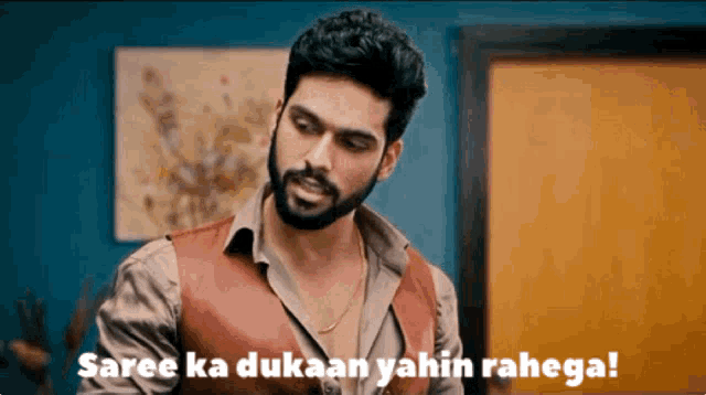 a man with a beard is saying saree ka dukaan yahin ranega