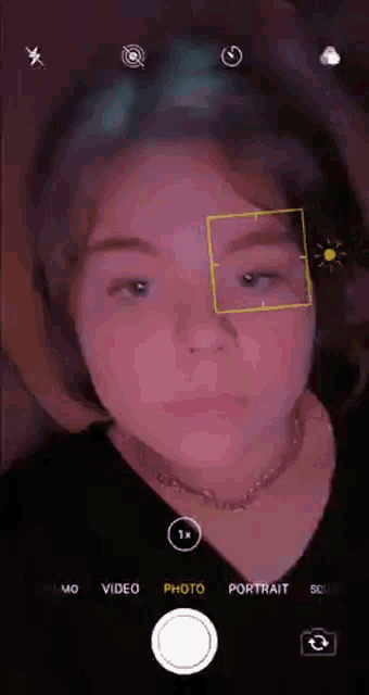 a girl is taking a picture of herself with a camera