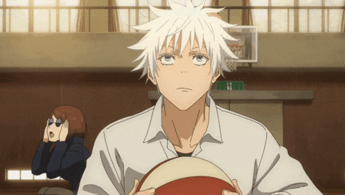 a man with white hair holds a basketball in his hands