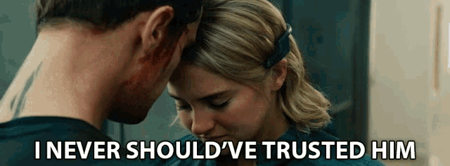 a man and a woman are looking at each other with the words " i never should ve trusted him " below them
