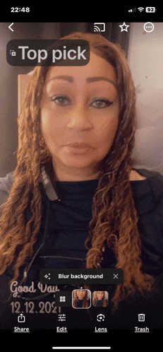 a woman 's face is displayed on a phone screen with the words top pick