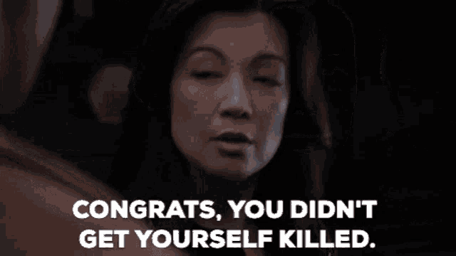 a woman is talking to a man and says congrats , you didn 't get yourself killed .