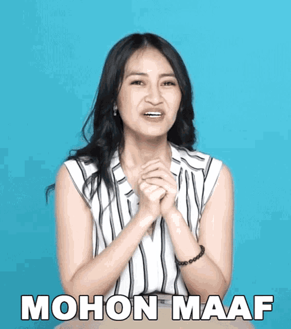 a woman with her hands folded and the word mohon maaf written on the bottom